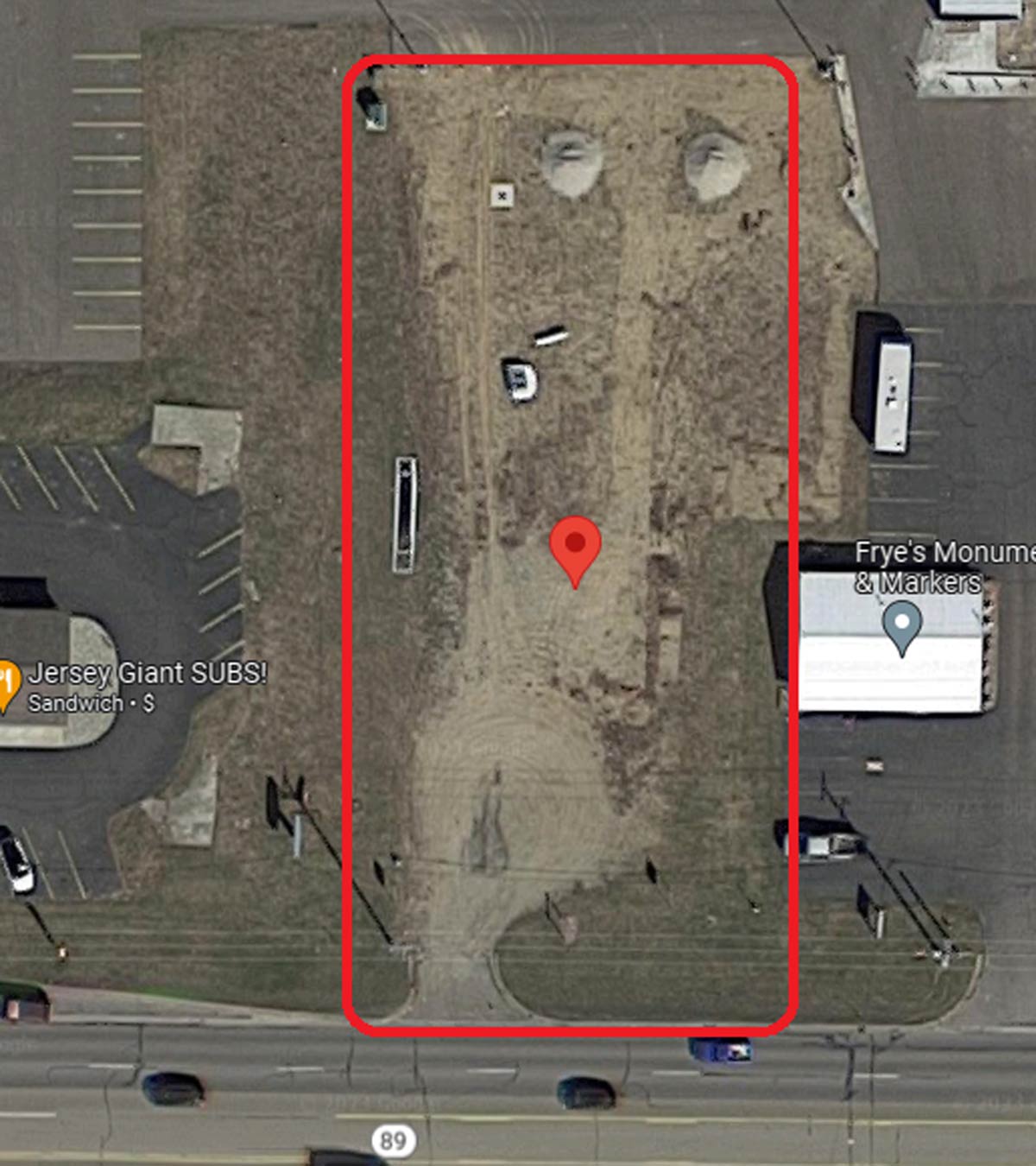 outline of rectangular lot in aerial photo