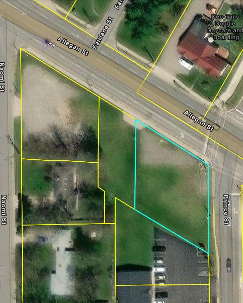 aerial view with outline of square parallelogram shaped property on corner